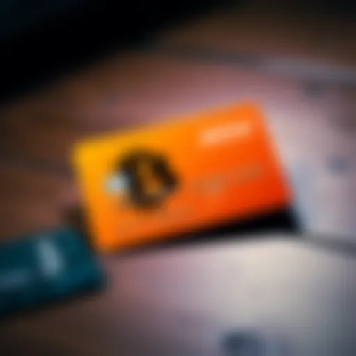 A new BTC orange credit card design, featuring an eye-catching orange color and sleek look, placed on a wooden table next to an old credit card.