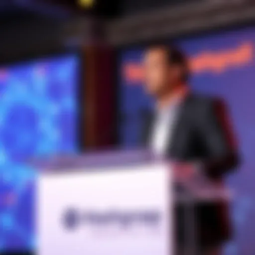 Kamal Youssefi speaking at a podium about The Hashgraph Association's initiatives