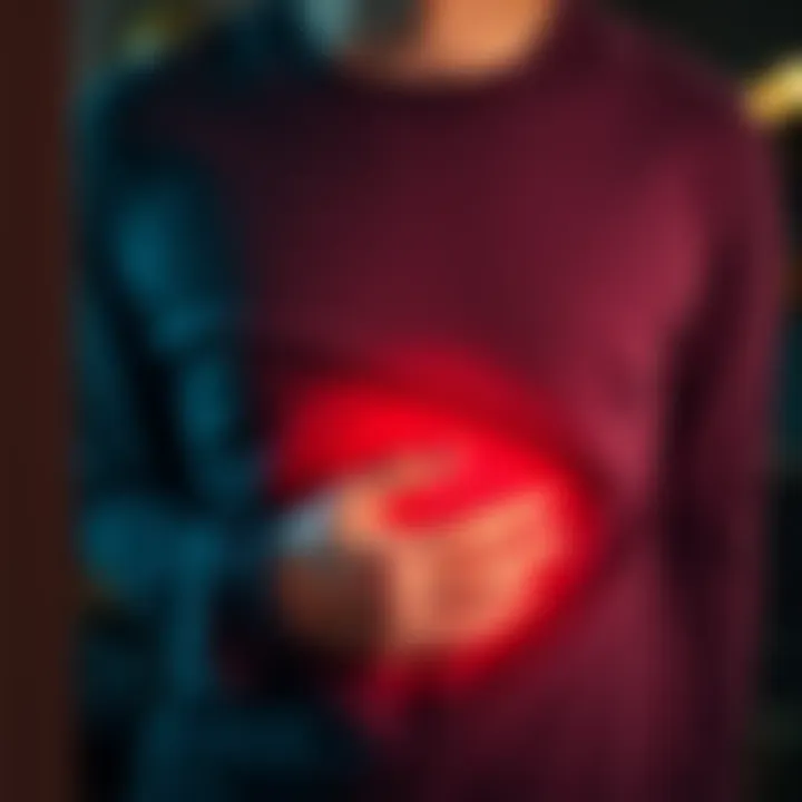 A person looks uncomfortable, holding their stomach as they experience nausea.